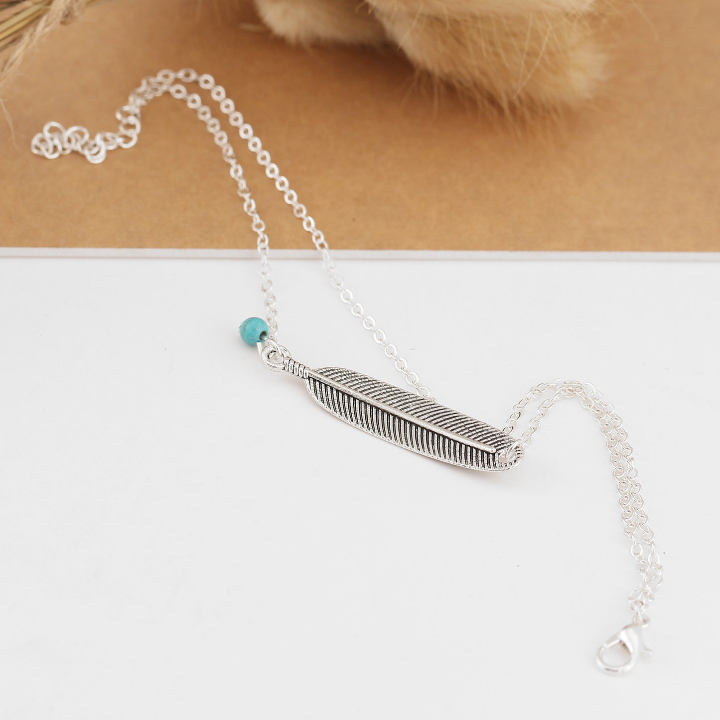 Feather anklet
